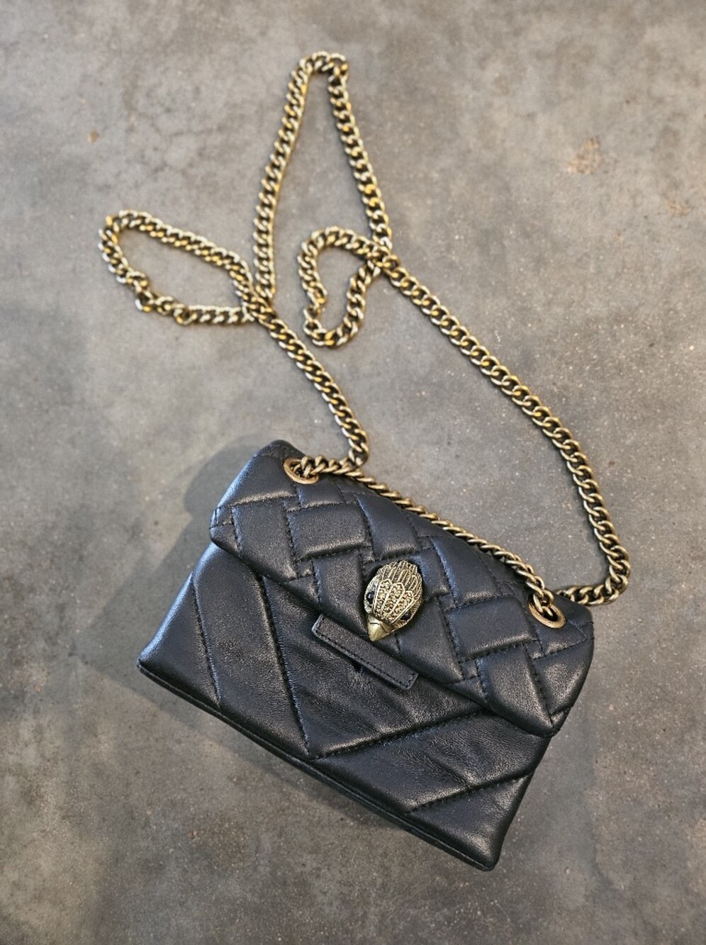 Kurt Geiger London black leather
mini leather kensington bag
Eagle Buckle